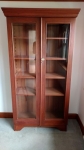 Tall glass display cabinet